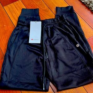 Womens black Lululemon joggers.